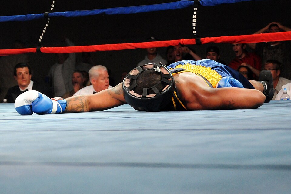 Boxer knocked down in the ring