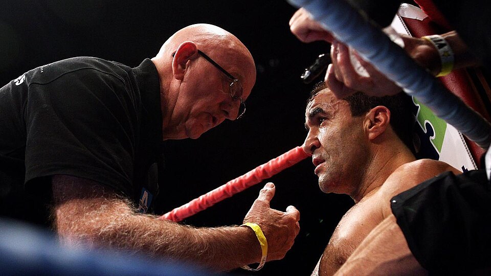 Trainer talking to a boxer in the corner