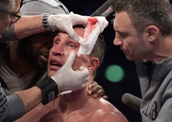 Cutman treating fighter