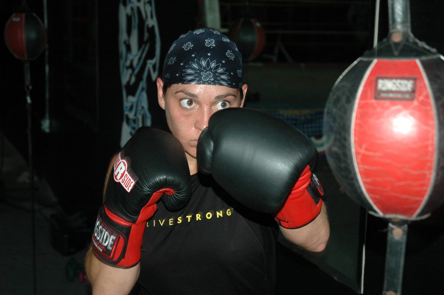 female athlete training on a double end bag