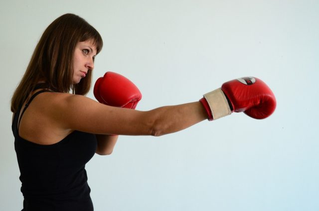female boxer on a punching pose