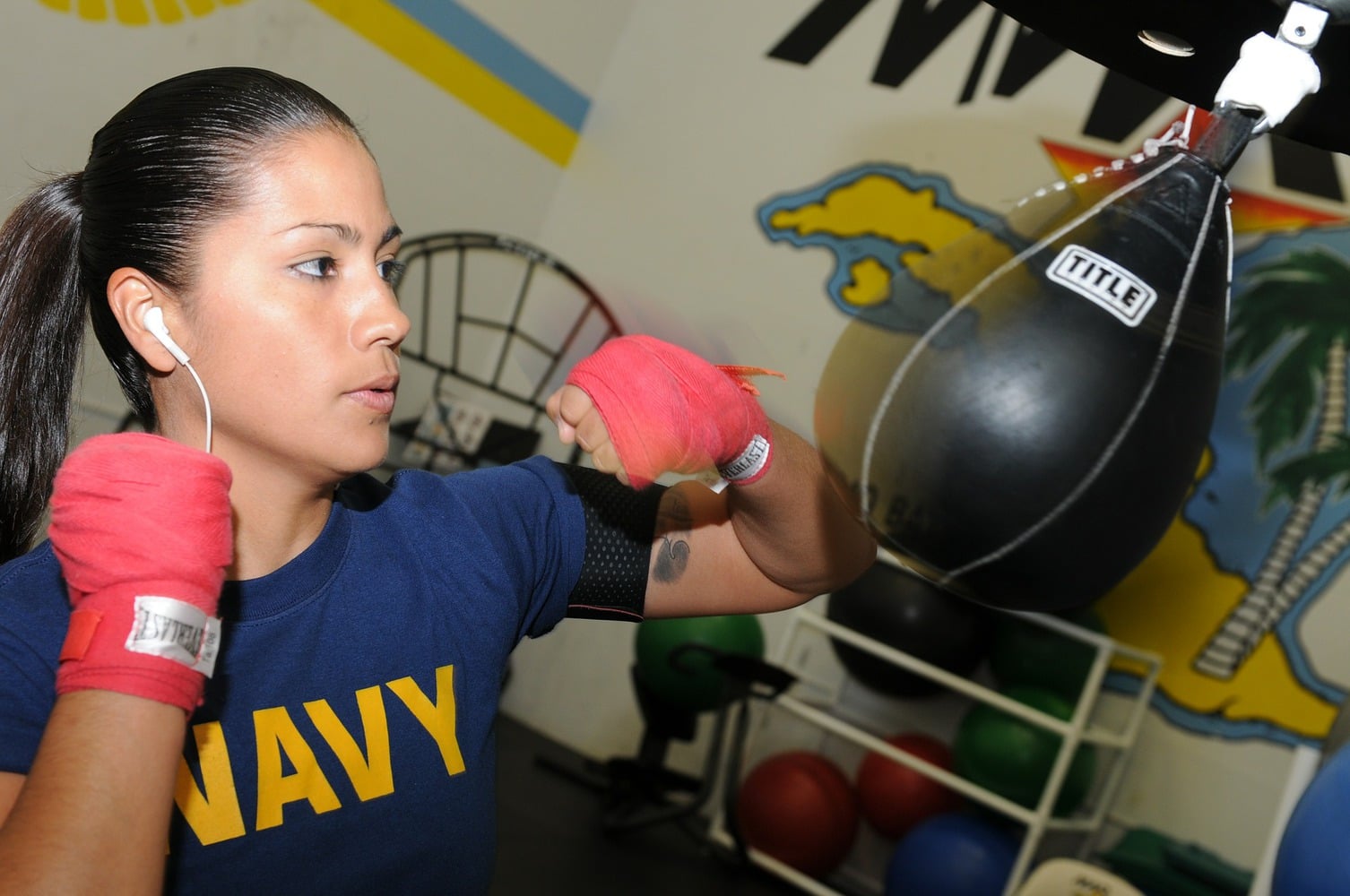 female boxer training on a speedbag