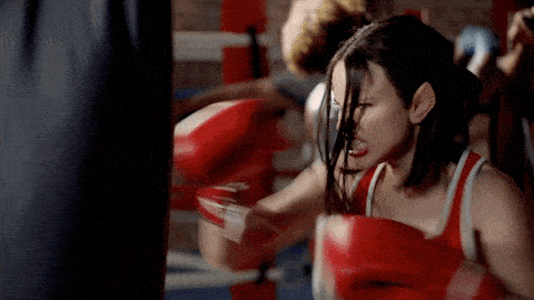 lady punching a heavy bag